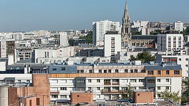 Aerial view over Paris. A wooden extension can be seen.