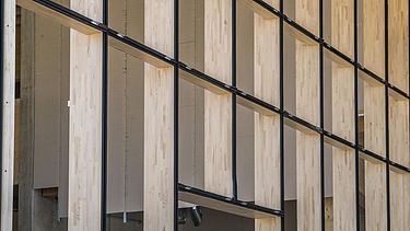 Photo of the wooden façade of the JOWAT Haus der Technik building.