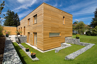 Residential house Krailing Photo of a modern LENO wooden house with wooden façade.