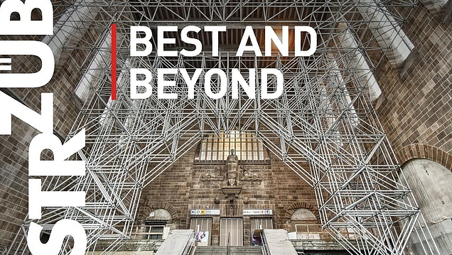 Photo of a scaffolded church. Thumbnail image from the video for BEST AND BEYOND.