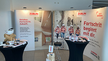 Photos of an empty ZÜBLIN Timber exhibition stand.
