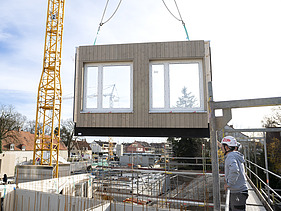 Photo of a LENO-ADD wooden element on the crane.