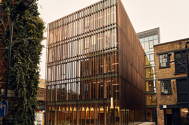 Black and White office, London Photo of the multi-storey office building Black and White in London. You can see a building with a wooden façade.
