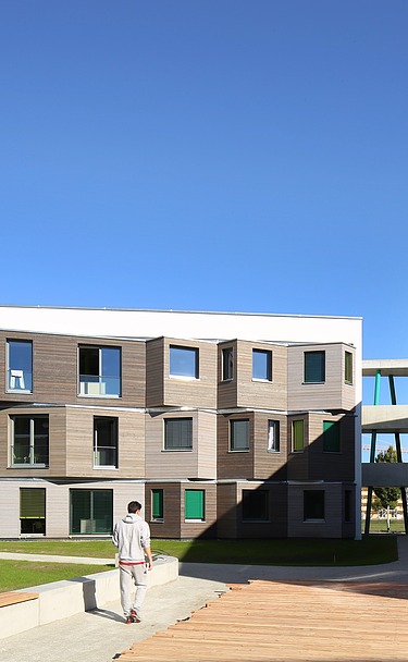 Student Village Adlershof Berlin Photo of the Adlershof student village in Berlin. You can see several wooden buildings.