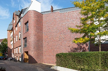 Wohnhaus Hamburg Foto eines Holzhauses mit Klinkerfassade.