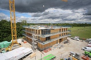 Photo of a multi-storey timber building during assembly.