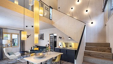 Foto des möblierten Wohnraums des Chalets Engel in Baiersbronn. Zu sehen sind viele Holzoberflächen.