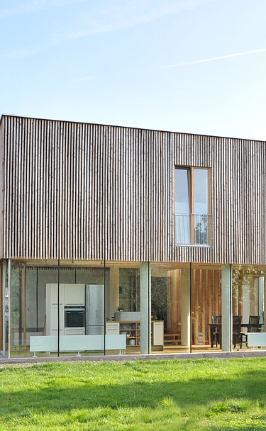 Residential building extension Aachen Photo of a timber house with flat roof. LENO-BSP.
