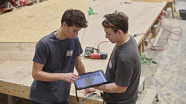 Sebastian in conversation with a colleague. 