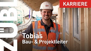 Nahaufnahme eines Projektleiters mit einem weißen ZÜBLIN-Bauhelm