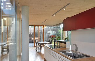 Photo of a timber house with flat roof. LENO-BSP. Detail picture kitchen.