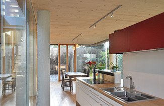 Photo of a timber house with flat roof. LENO-BSP. Detail picture kitchen.