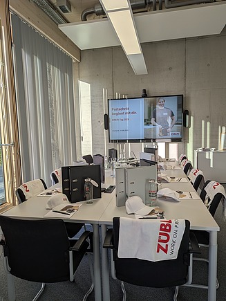 Picture of the prepared training room with small welcome gifts. 
