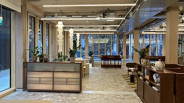 Photo of an interior of the Black and White office in London. You can see a lounge.