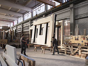 Photo of a timber frame construction element in the ZÜBLIN Timber production hall.