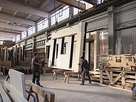 Photo of a timber frame construction element in the ZÜBLIN Timber production hall.