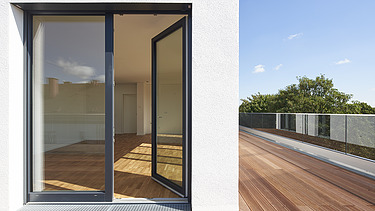 Foto eines Terrassenausschnittes einer Aufstockung mit Flachdach.