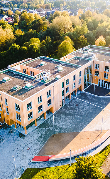 University, Witten-Herdecke Photo of Witten University from the outside. You can see a large wooden building.