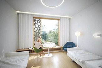 Innenansicht eines Patientenzimmers mit Blick auf die blattförmigen Elemente der Fassade.  