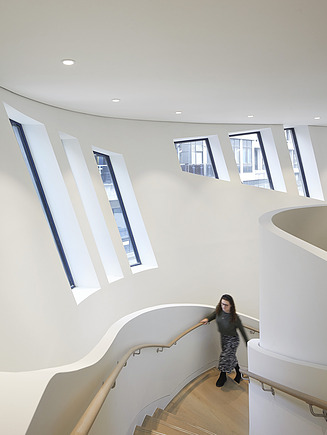 Interior view of the Maggie Center in London. You can see a staircase.