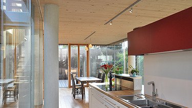 Photo of a timber house with flat roof. LENO-BSP. Detail picture kitchen.