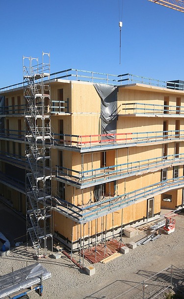 Photo of a multi-storey timber building during assembly.