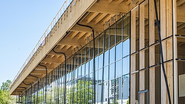 Photo of the wooden and glass façade of the JOWAT Haus der Technik building.