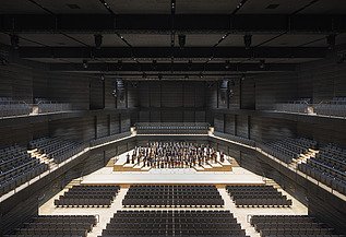 Interim venue Gasteig Munich Photo of the interim venue Gasteig in Munich. You can see the seated stage area with orchestra.