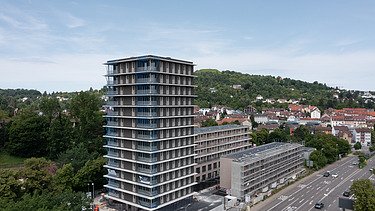 Photo of the CARL wooden building in Pforzheim. You can see an exterior shot with a brown wooden façade.