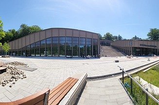 The complex comprises three separate buildings, separated from one another by a grand open staircase. 