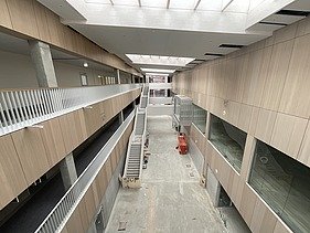 Photo of the interior fit-out of a commercial building. You can see many wooden surfaces.