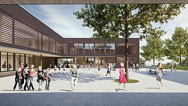 Außenaufnahme der Schule am Hang, Frankfurt. Man sieht ein großes Gebäude.