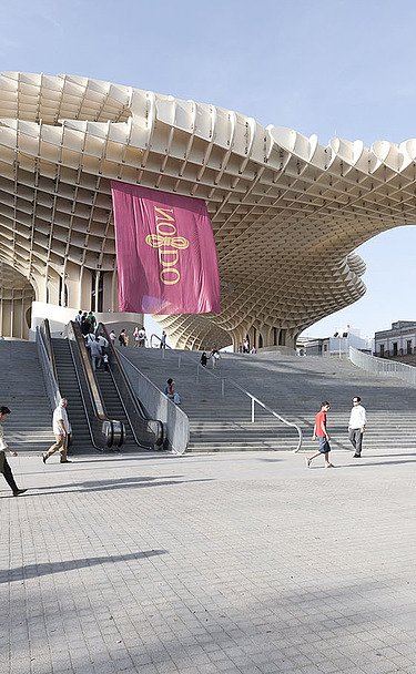 Metropol Parasol Sevilla Photo of the Metropol Parasol marketplace in Seville Spain. You can see very large and high mushroom-like wooden constructions.