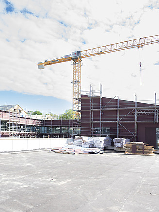 Photo of the school on the slope construction site.