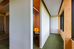 Photo of a hallway. You can see a LENO ADD wooden exterior wall.