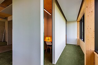 Photo of a hallway. You can see a LENO ADD wooden exterior wall.