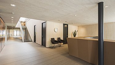 Photo of the FGS Augsburg law firm. Modern interior with many wooden surfaces.