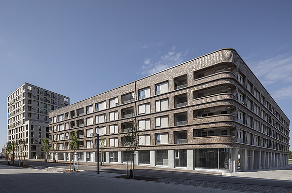 Photo of a multi-storey timber building with a curtain wall.