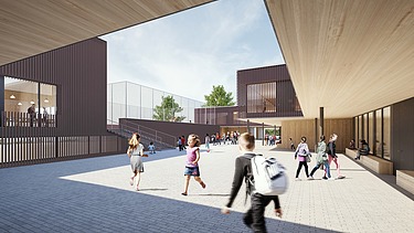 Außenaufnahme der Schule am Hang, Frankfurt. Man sieht ein großes Gebäude.