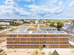 Photo of the Collegium Academicum in Heidelberg. You can see a building made of wood.