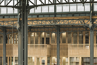Photo inside the hall of Gare Maritime Brussels. View of a balcony parapet.
