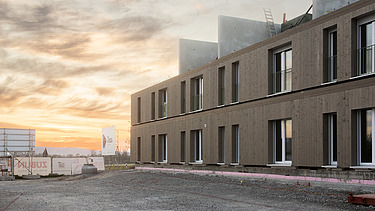 Außenansicht des Holz-Hybrid-Baus Quartier Hangweide in Kernen.