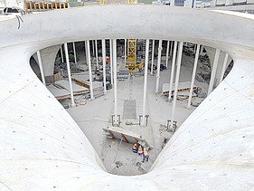 Photo of a chalice column eye of the Stuttgart21 project from above. Everyday construction site life.