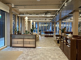 Photo of an interior of the Black and White office in London. You can see a lounge.