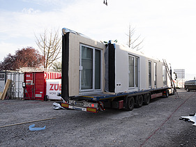 Photo of LENO-ADD timber construction elements on a truck trailer.