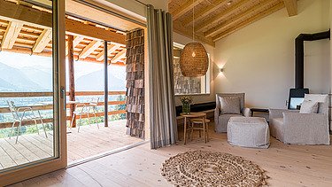 Photo of a hotel room with a view of the mountains.