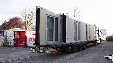 Photo of LENO-ADD timber construction elements on a truck trailer.