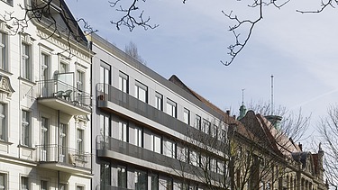 Foto mehrerer mehrgeschossiger Reihenhäuser.