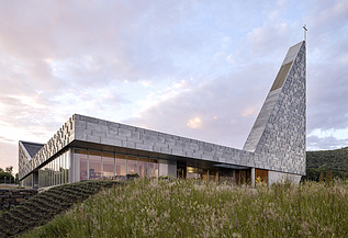 Photo of the Tau Kirke in TAU Norway. You can see a modern building.