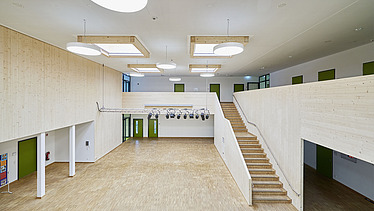 Photo of a corridor area of the school in Munich. You can see a staircase and a foye.